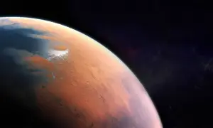 Widok Marsa z kosmosu. Czerwona planeta z lodowymi czapami i kraterami. Jaka temperatura jest na Marsie? Niska, średnio -63°C.