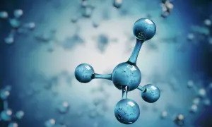 Model cząsteczki metanu, składający się z jednego centralnego atomu węgla i czterech atomów wodoru, unoszący się w niebieskim, rozmytym tle.