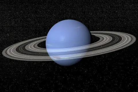 Błękitny Neptun z pierścieniami na tle gwiezdnego nieba. Zastanawiasz się, ile trwa rok na Neptunie? To aż 165 ziemskich lat!
